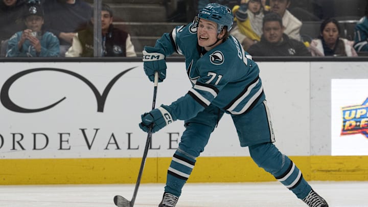 Apr 7, 2025; San Jose, California, USA;  San Jose Sharks center Macklin Celebrini (71) shoots the puck during the second period against the Calgary Flames at SAP Center at San Jose. Mandatory Credit: Stan Szeto-Imagn Images