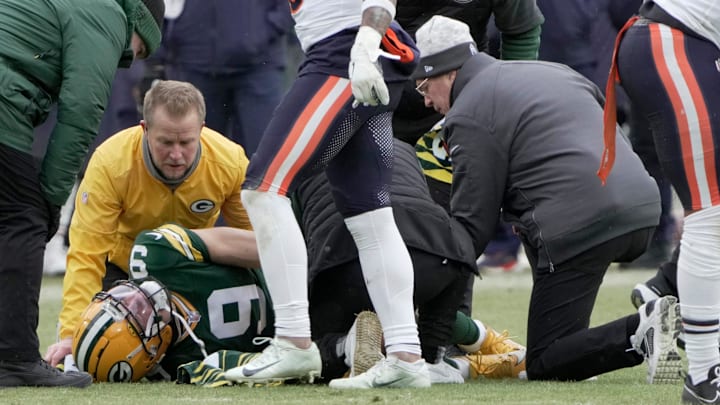Green Bay Packers wide receiver Christian Watson (9) is tended to after sustaining a knee injury against the Chicago Bears. Green Bay Packers wide receiver Christian Watson (9) is tended to after sustaining a knee injury against the Chicago Bears.
