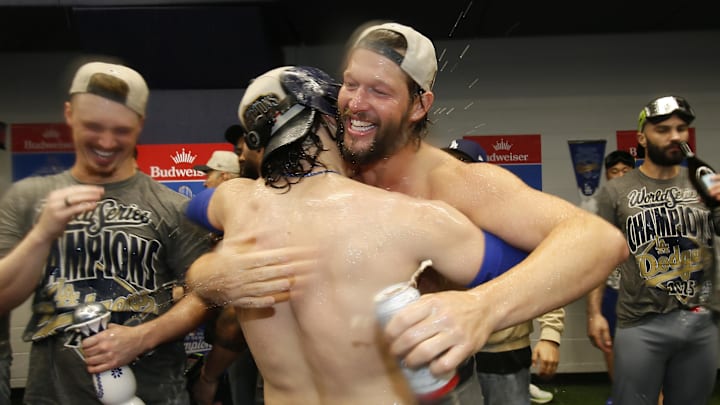 Oct 31, 2025; Toronto, Ontario, CAN; Los Angeles Dodgers pitcher Clayton Kershaw (22) and first baseman Enrique Hernandez (8) celebrate after defeating the Toronto Blue Jays in the 2025 MLB World Series at Rogers Centre. Mandatory Credit: John E. Sokolowski-Imagn Images