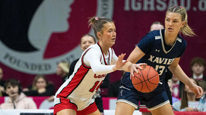 North Polk's Campbell Schulz guards Cedar Rapids Xavier's Libby Fandel during the 4A IGHSAU state basketball championship at Wells Fargo Arena on Saturday, March 8, 2025, in Des Moines.