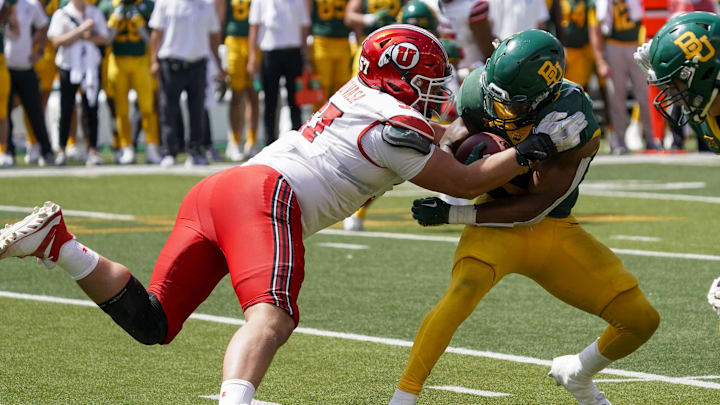 Sep 9, 2023; Waco, Texas, USA; Utah Utes defensive tackle Keanu Tanuvasa (57) tackles Baylor Bears running back Richard Reese (29) during the second half at McLane Stadium. Mandatory Credit: Raymond Carlin III-Imagn Images Sep 9, 2023; Waco, Texas, USA; Utah Utes defensive tackle Keanu Tanuvasa (57) tackles Baylor Bears running back Richard Reese (29) during the second half at McLane Stadium. Mandatory Credit: Raymond Carlin III-Imagn Images