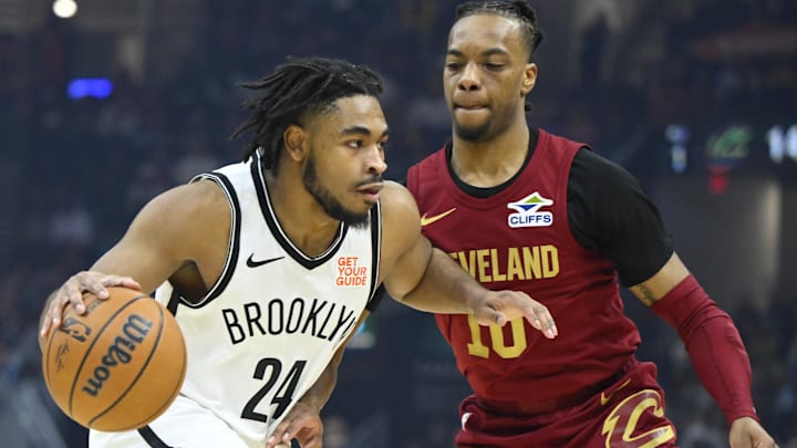 Mar 11, 2025; Cleveland, Ohio, USA; Brooklyn Nets guard Cam Thomas (24) dribbles beside Cleveland Cavaliers guard Darius Garland (10) in the first quarter at Rocket Arena. Mandatory Credit: David Richard-Imagn Images