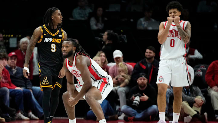 Ohio State Buckeyes guard Bruce Thornton (2) and guard John Mobley Jr. (0) react beside Appalachian State Mountaineers guard Jalen Tot (9) during the NCAA men's basketball game at Value City Arena in Columbus on Nov. 11, 2025. Ohio State won 75-53.