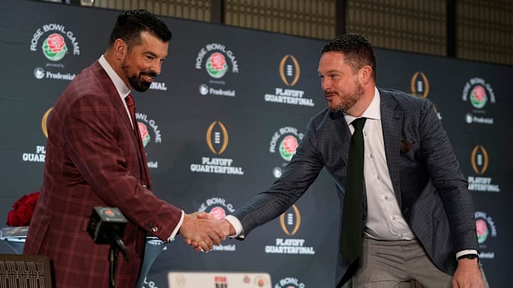 Ohio State Buckeyes head coach Ryan Day shakes hands with Oregon Ducks head coach Dan Lanning during a Rose Bowl press conference in Los Angeles on Dec. 31, 2024.