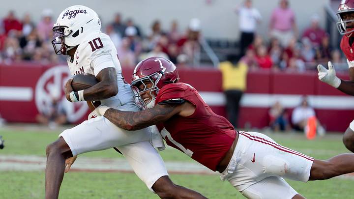 Oct 24, 2026; Tuscaloosa, AL, USA; Texas A&M quarterback Marcel Reed (10) is tackled behind the line of scrimmage on a running play by Alabama linebacker Caleb Woodson (7) at Saban Field at Bryant Denny Stadium. Alabama defeated Texas A&M 31-20. Mandatory Credit: Gary Cosby Jr.-Tuscaloosa News Oct 24, 2026; Tuscaloosa, AL, USA; Texas A&M quarterback Marcel Reed (10) is tackled behind the line of scrimmage on a running play by Alabama linebacker Caleb Woodson (7) at Saban Field at Bryant Denny Stadium. Alabama defeated Texas A&M 31-20. Mandatory Credit: Gary Cosby Jr.-Tuscaloosa News