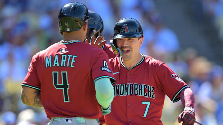 Aug 31, 2025; Los Angeles, California, USA; Arizona Diamondbacks left fielder Corbin Carroll (7) is congratulated by second baseman Ketel Marte (4) after crossing the plate a three-run home run during the eighth inning off Los Angeles Dodgers relief pitcher Tanner Scott (66) at Dodger Stadium. Mandatory Credit: Jayne Kamin-Oncea-Imagn Images Aug 31, 2025; Los Angeles, California, USA; Arizona Diamondbacks left fielder Corbin Carroll (7) is congratulated by second baseman Ketel Marte (4) after crossing the plate a three-run home run during the eighth inning off Los Angeles Dodgers relief pitcher Tanner Scott (66) at Dodger Stadium. Mandatory Credit: Jayne Kamin-Oncea-Imagn Images
