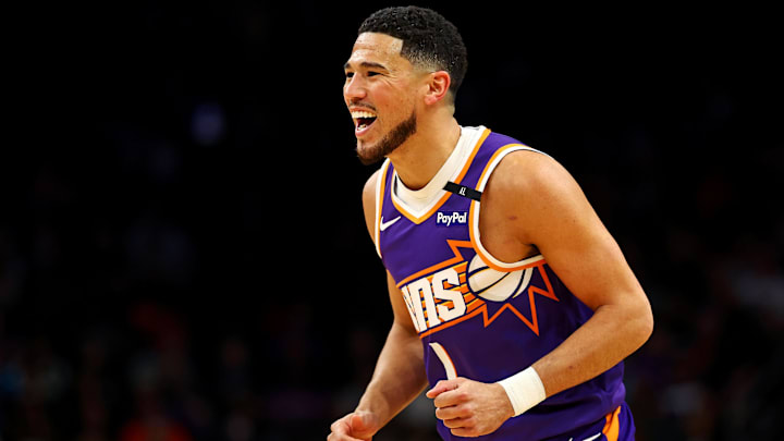 Mar 24, 2025; Phoenix, Arizona, USA; Phoenix Suns guard Devin Booker (1) reacts after a play during the first quarter against the Milwaukee Bucks at Footprint Center. Mandatory Credit: Mark J. Rebilas-Imagn Images