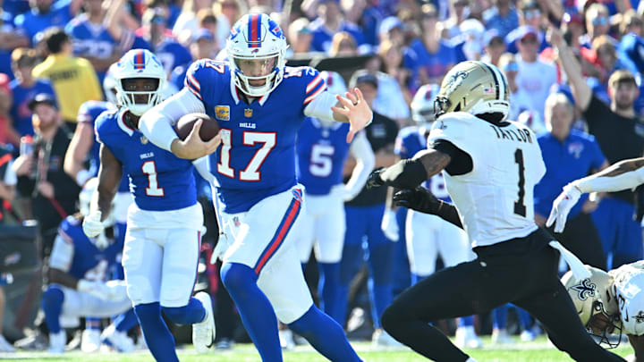 Bills quarterback Josh Allen (17) runs for a gain past Saints cornerback Alontae Taylor (1) in Week 4.