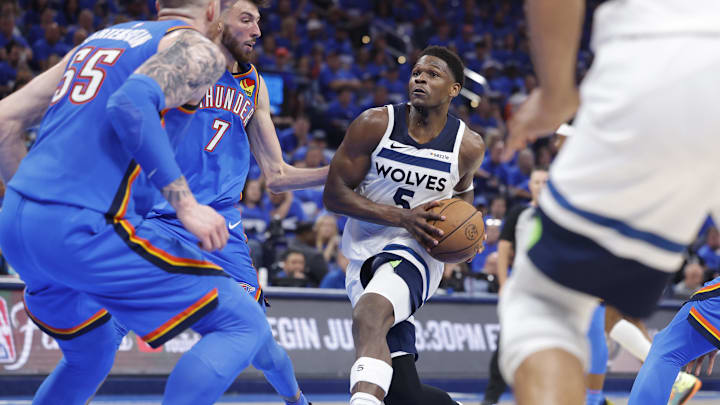 May 22, 2025; Oklahoma City, Oklahoma, USA; Minnesota Timberwolves guard Anthony Edwards (5) drives against Oklahoma City Thunder forward Chet Holmgren (7) in the third quarter during game two of the western conference finals for the 2025 NBA Playoffs at Paycom Center. Mandatory Credit: Alonzo Adams-Imagn Images