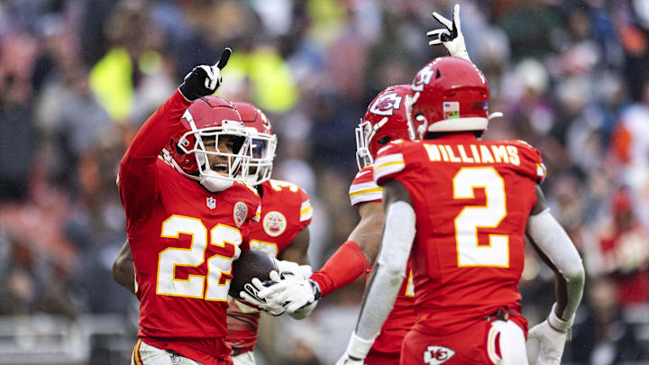Dec 15, 2024; Cleveland, Ohio, USA; Kansas City Chiefs cornerback Trent McDuffie (22) celebrates his interception with teammates against the Cleveland Browns during the fourth quarter at Huntington Bank Field. Mandatory Credit: Scott Galvin-Imagn Images