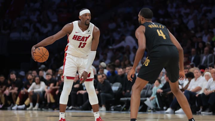 Apr 26, 2025; Miami, Florida, USA; Miami Heat center Bam Adebayo (13) dribbles the basketball as Cleveland Cavaliers forward Evan Mobley (4) defends in the third quarter during game three for the first round of the 2025 NBA Playoffs at Kaseya Center. Mandatory Credit: Sam Navarro-Imagn Images