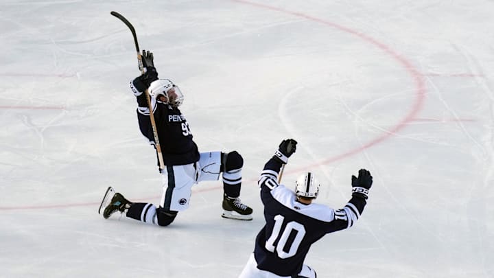 Penn State Nittany Lions forward Shea Van Olm (93) celebrates his goal with defenseman Nick Fascia (10) during the third period against the Michigan State Spartans at Beaver Stadium. 