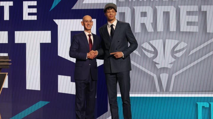 Jun 26, 2024; Brooklyn, NY, USA; Tidjane Salaun poses for photos with NBA commissioner Adam Silver after being selected in the first round by the Charlotte Hornets in the 2024 NBA Draft at Barclays Center. Mandatory Credit: Brad Penner-USA TODAY Sports