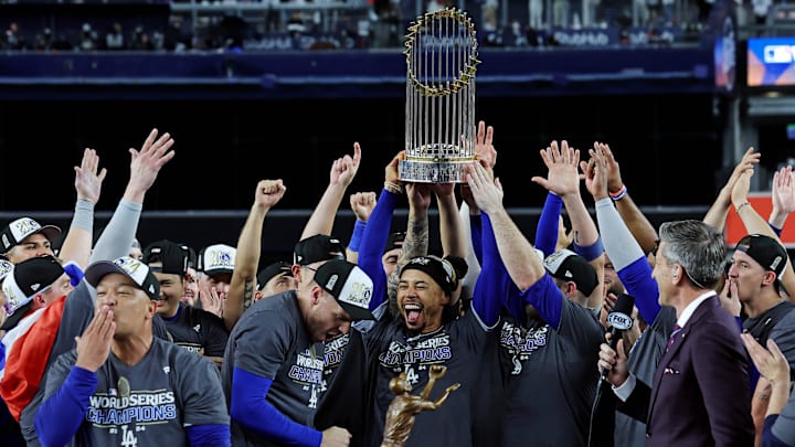 Oct 31, 2024; New York, New York, USA; Los Angeles Dodgers shortstop Mookie Betts (50) celebrates with the Commissioner’s Trophy after the Los Angeles Dodgers beat the New York Yankees in game four to win the 2024 MLB World Series at Yankee Stadium. Oct 31, 2024; New York, New York, USA; Los Angeles Dodgers shortstop Mookie Betts (50) celebrates with the Commissioner’s Trophy after the Los Angeles Dodgers beat the New York Yankees in game four to win the 2024 MLB World Series at Yankee Stadium.