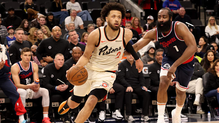 Mar 5, 2025; Inglewood, California, USA; Detroit Pistons guard Cade Cunningham (2) drives against LA Clippers guard James Harden (1) : Jason Parkhurst-Imagn Images