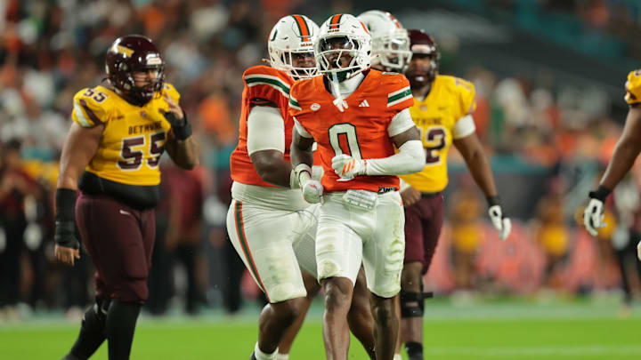 Sep 6, 2025; Miami Gardens, Florida, USA; Miami Hurricanes defensive back Keionte Scott (0) reacts after a play against the Bethune-Cookman Wildcats during the third quarter at Hard Rock Stadium. Mandatory Credit: Sam Navarro-Imagn Images