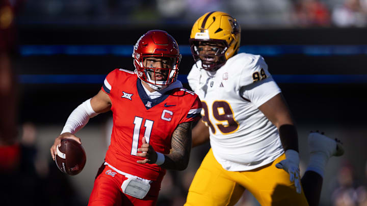 Nov 30, 2024; Tucson, Arizona, USA; Arizona Wildcats quarterback Noah Fifita (11) against the Arizona State Sun Devils during the Territorial Cup at Arizona Stadium. Mandatory Credit: Mark J. Rebilas-Imagn Images