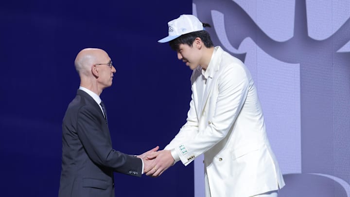 Jun 25, 2025; Brooklyn, NY, USA;  Yang Hansen greets NBA commissioner Adam Silver after being selected as the 16th pick by the Memphis Grizzlies in the first round of the 2025 NBA Draft at Barclays Center. Mandatory Credit: Brad Penner-Imagn Images