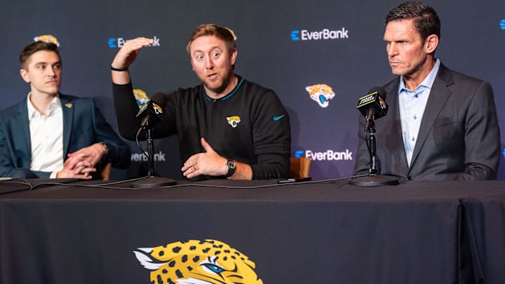 The Jacksonville Jaguars introduce General Manager James Gladstone, left, Monday morning February 24, 2025 at the Miller Electric Center in Jacksonville, Fla. as he listened to Head Coach Liam Coen, center, talk about how Gladstone was bringing a new level of skills to the organization during the press conference as Executive Vice President of Football Operations Tony Boselli, right, listened. [Doug Engle/Florida Times-Union]2025