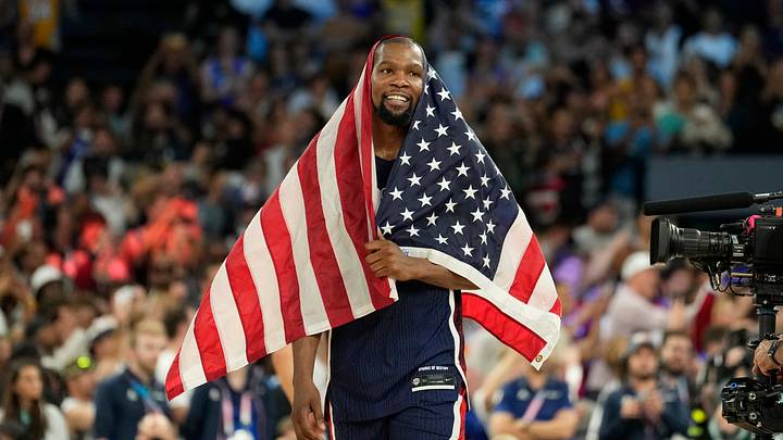 Aug 10, 2024; Paris, France; United States guard Kevin Durant (7) celebrates after defeating France in the men's basketball gold medal game during the Paris 2024 Olympic Summer Games at Accor Arena. Mandatory Credit: Kyle Terada-USA TODAY Sports Aug 10, 2024; Paris, France; United States guard Kevin Durant (7) celebrates after defeating France in the men's basketball gold medal game during the Paris 2024 Olympic Summer Games at Accor Arena. Mandatory Credit: Kyle Terada-USA TODAY Sports