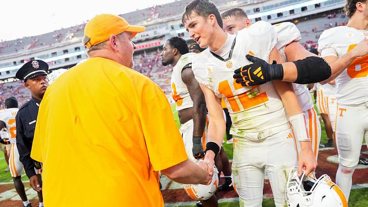 Tennessee coach Josh Heupel shakes hands with Tennessee quarterback George MacIntyre (12) after a college football game between Tennessee and Arkansas at Donald W. Reynolds Razorback Stadium in Fayetteville, Ark., on Oct. 10, 2026. Tennessee coach Josh Heupel shakes hands with Tennessee quarterback George MacIntyre (12) after a college football game between Tennessee and Arkansas at Donald W. Reynolds Razorback Stadium in Fayetteville, Ark., on Oct. 10, 2026.