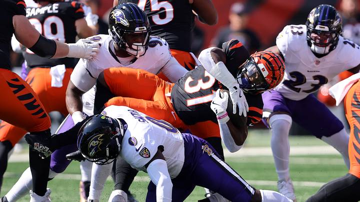 Oct 6, 2024; Cincinnati, Ohio, USA; Cincinnati Bengals running back Zack Moss (31) runs the ball as Baltimore Ravens linebacker Roquan Smith (0) and defensive tackle Nnamdi Madubuike (92) make the tackle during the first quarter at Paycor Stadium. Mandatory Credit: Joseph Maiorana-Imagn Images Oct 6, 2024; Cincinnati, Ohio, USA; Cincinnati Bengals running back Zack Moss (31) runs the ball as Baltimore Ravens linebacker Roquan Smith (0) and defensive tackle Nnamdi Madubuike (92) make the tackle during the first quarter at Paycor Stadium. Mandatory Credit: Joseph Maiorana-Imagn Images