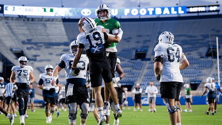 BYU quarterback Bear Bachmeier celebrates with brother Tiger Bachmeier at Fall Camp
