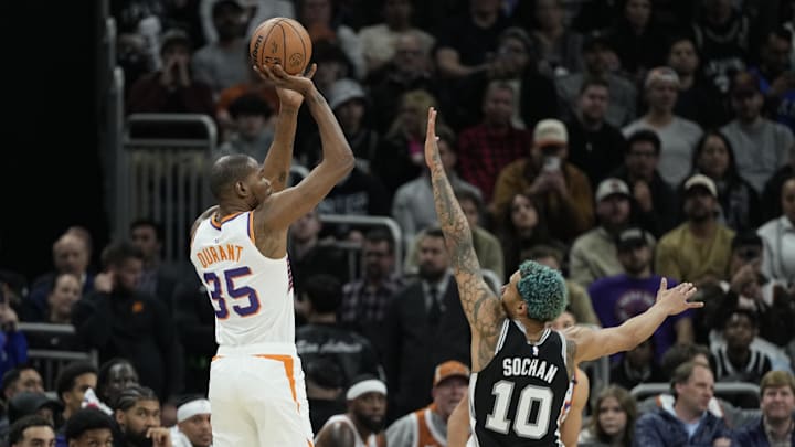 Feb 20, 2025; Austin, Texas, USA; Phoenix Suns forward Kevin Durant (35) shoots over San Antonio Spurs forward Jeremy Sochan (10) during the second half at Moody Center. Mandatory Credit: Scott Wachter-Imagn Images
