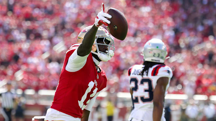 Sep 29, 2024; Santa Clara, California, USA; San Francisco 49ers wide receiver Brandon Aiyuk (11) celebrates after a catch against the New England Patriots during the first quarter at Levi's Stadium. Mandatory Credit: Sergio Estrada-Imagn Images