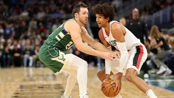 Pat Connaughton, Milwaukee Bucks (left); Matisse Thybulle, Portland Trail Blazers