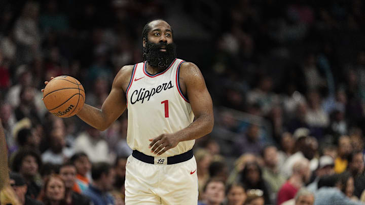 Jan 31, 2025; Charlotte, North Carolina, USA; LA Clippers guard James Harden (1) handles the ball against the Charlotte Hornets during the second half at Spectrum Center. Mandatory Credit: Jim Dedmon-Imagn Images