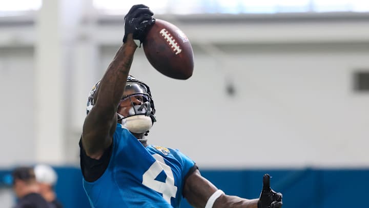 Jacksonville Jaguars running back Tank Bigsby (4) can’t make a catch during the 10th organized team activity at Miller Electric Center Wednesday, June 4, 2025 in Jacksonville, Fla. [Corey Perrine/Florida Times-Union]