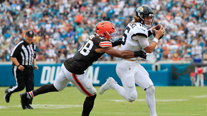Jacksonville Jaguars quarterback Trevor Lawrence (16) is wrapped up by Cleveland Browns linebacker Jordan Hicks (58) during the second quarter of an NFL football matchup Sunday, Sept. 15, 2024 at EverBank Stadium in Jacksonville, Fla. The Browns defeated the Jaguars 18-13. Jacksonville Jaguars quarterback Trevor Lawrence (16) is wrapped up by Cleveland Browns linebacker Jordan Hicks (58) during the second quarter of an NFL football matchup Sunday, Sept. 15, 2024 at EverBank Stadium in Jacksonville, Fla. The Browns defeated the Jaguars 18-13.
