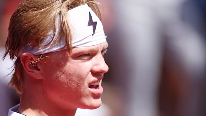 American League outfielder Max Clark of the Detroit Tigers looks on while wearing a headband with a lightning bolt on it. American League outfielder Max Clark of the Detroit Tigers looks on while wearing a headband with a lightning bolt on it.