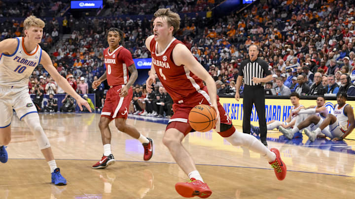 Mar 15, 2025; Nashville, TN, USA; Alabama Crimson Tide forward Grant Nelson (4) drives to the basket against the Florida Gators during the first half at Bridgestone Arena. Mandatory Credit: Steve Roberts-Imagn Images Mar 15, 2025; Nashville, TN, USA; Alabama Crimson Tide forward Grant Nelson (4) drives to the basket against the Florida Gators during the first half at Bridgestone Arena. Mandatory Credit: Steve Roberts-Imagn Images
