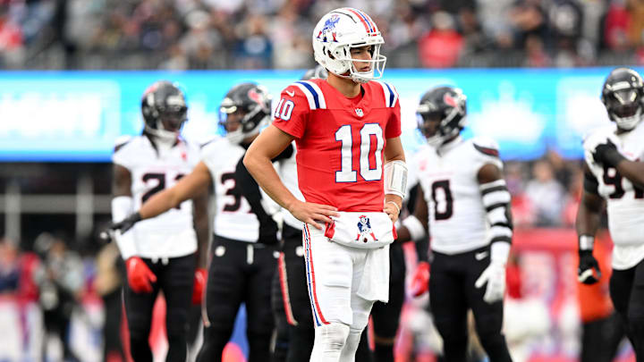 Oct 13, 2024; Foxborough, Massachusetts, USA; New England Patriots quarterback Drake Maye (10) reacts after a sack  during the first half of a game against the Houston Texans at Gillette Stadium. Mandatory Credit: Brian Fluharty-Imagn Images