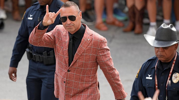 Sep 20, 2025; Austin, Texas, USA; Texas Longhorns head coach Steve Sarkisian holds up his horns while entering Darrell K Royal-Texas Memorial Stadium before a game against the Sam Houston State Bearkats. Mandatory Credit: Scott Wachter-Imagn Images