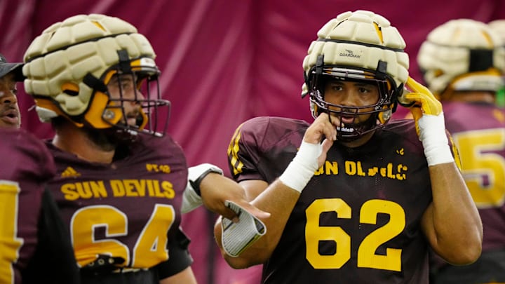 Arizona State offensive linemen Wade Helton (64) and Ben Coleman (62) run a drill during a practice inside the Verde Dickey Dome in Tempe on August 12, 2025.
