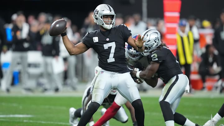 Dec 28, 2025; Paradise, Nevada, USA; Las Vegas Raiders quarterback Geno Smith (7) throws in the third quarter against the New York Giants at Allegiant Stadium. Mandatory Credit: Kirby Lee-Imagn Images