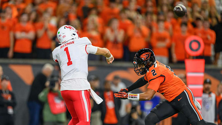 Sep 26, 2025; Corvallis, Oregon, USA; Houston Cougars quarterback Conner Weigman (1) throws a pass under pressure from Oregon State Beavers linebacker Aiden Sullivan (2) during the first quarter at Reser Stadium. Mandatory Credit: Craig Strobeck-Imagn Images Sep 26, 2025; Corvallis, Oregon, USA; Houston Cougars quarterback Conner Weigman (1) throws a pass under pressure from Oregon State Beavers linebacker Aiden Sullivan (2) during the first quarter at Reser Stadium. Mandatory Credit: Craig Strobeck-Imagn Images