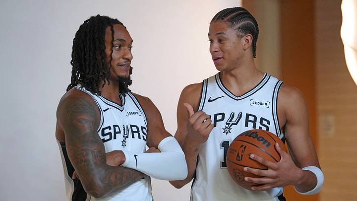 Sep 28, 2026; San Antonio, TX, USA; San Antonio Spurs guard Devin Vassell (24) and forward Carter Bryant (11) pose for photos during Media Day at Victory Capital Performance Center in San Antonio, Texas.