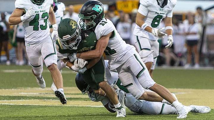 Van Buren defensive back Abe Cone (11) tackles a ball carrier during a recent game. Van Buren defensive back Abe Cone (11) tackles a ball carrier during a recent game.