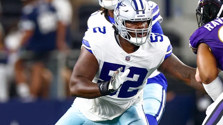 Dallas Cowboys guard Tyler Booker blocks during the first half against the Baltimore Ravens.