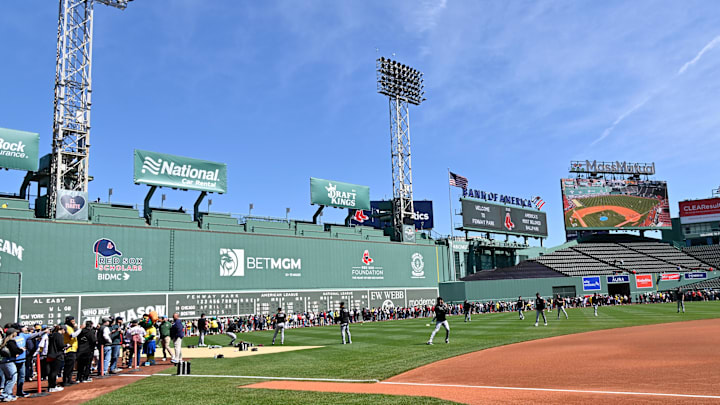 Apr 20, 2025; Boston, Massachusetts, USA; Fans line the field in front of the Green Monster as the Chicago White Sox warm up before a game at Fenway Park. Mandatory Credit: Eric Canha-Imagn Images Apr 20, 2025; Boston, Massachusetts, USA; Fans line the field in front of the Green Monster as the Chicago White Sox warm up before a game at Fenway Park. Mandatory Credit: Eric Canha-Imagn Images