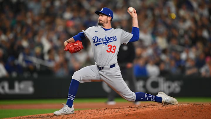 Sep 27, 2025; Seattle, Washington, USA; Los Angeles Dodgers relief pitcher Andrew Heaney (33) pitches to the Seattle Mariners during the fourth inning at T-Mobile Park. Mandatory Credit: Steven Bisig-Imagn Images