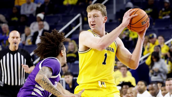 Nov 21, 2024; Ann Arbor, Michigan, USA;  Michigan Wolverines center Danny Wolf (1) is defended by Tarleton Texans guard Izzy Miles (0) in the first half at Crisler Center. Mandatory Credit: Rick Osentoski-Imagn Images
