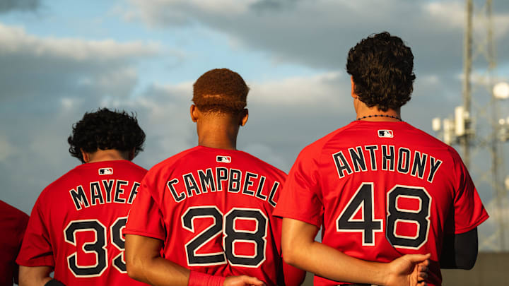 Boston's top-three prospects in Marcelo Mayer, Kristian Campbell and Roman Anthony stand for the national anthem ahead of a Spring Training breakout game on March 13, 2025.