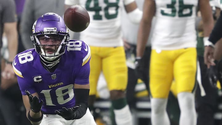 Dec 31, 2023; Minneapolis, Minnesota, USA; Minnesota Vikings wide receiver Justin Jefferson (18) makes a first down reception against the Green Bay Packers during their game at U.S. Bank Stadium. Mandatory Credit: Dan Powers-Imagn Images