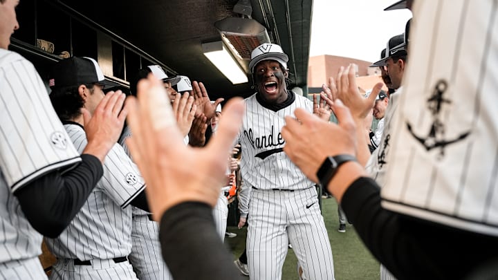 Vanderbilt centerfielder RJ Austin high fives his teammates as the Commodores prepared to face Texas A&M on Friday.