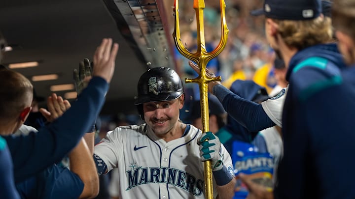 Sep 24, 2025; Seattle, Washington, USA; Seattle Mariners catcher Cal Raleigh (29) celebrates in the dugout after hitting a solo home run during the eighth inning against the Colorado Rockies at T-Mobile Park. Mandatory Credit: Stephen Brashear-Imagn Images
